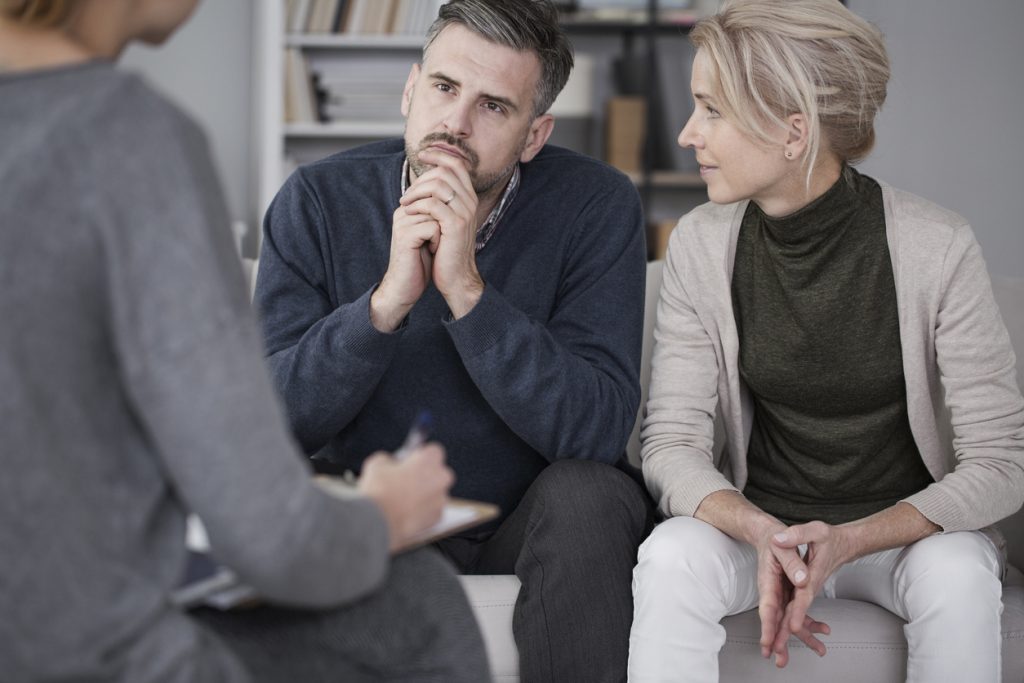 Wife supporting husband in therapy